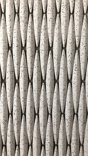 Textured geometric pattern with speckled white teardrops on dark gray lines. — Rainbow Gradient Background