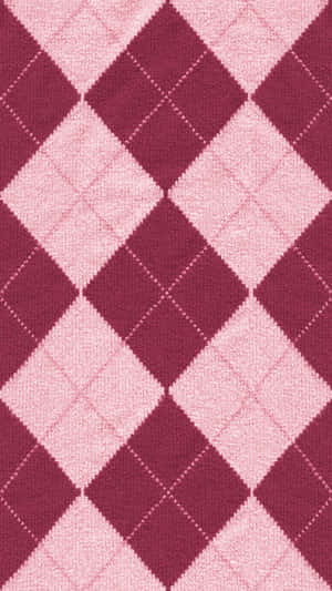 Close-up of pink argyle knit fabric with diamond pattern. — Diamond Pattern Picture