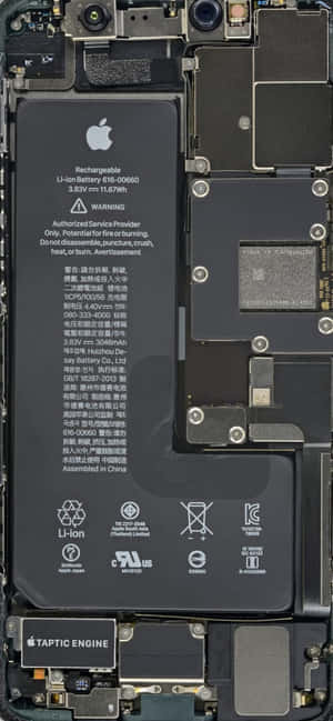 Disassembled iPhone showing battery circuit board and Taptic Engine. — Uchiha iPhone Picture