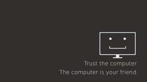 Smiling computer monitor with text trust the computer the computer is your friend — Programming Picture