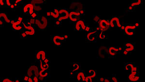 Rote Fragezeichen schweben in der Dunkelheit und symbolisieren Geheimnis und Unsicherheit. — Hintergrund Wallpaper