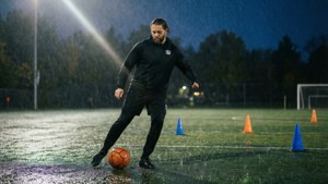 Andi Sullivan training in the rain, focused on her skills.