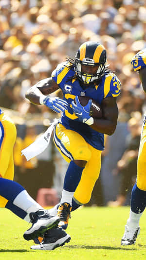 Football player running with ball during game — Rams iPhone Picture