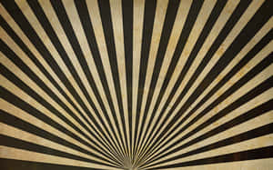 Vintage sunburst pattern with black and beige stripes on textured paper. — Here Comes The Sun Picture