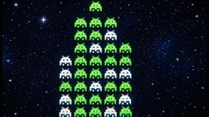 Classic arcade grid of Space Invaders descending on a starry background.