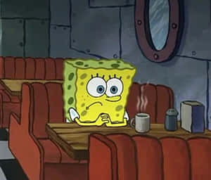 SvampBob sitter i en dinerbås och ser ledsen ut med en ångande mugg. — Spongebob Bilder