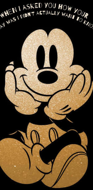 Glittery gold Mickey Mouse with hands clasped and text above