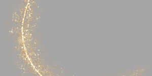 Curved trail of golden glitter particles on gray background