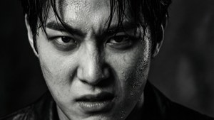 Intense black and white close-up of Shownu with dramatic lighting.
