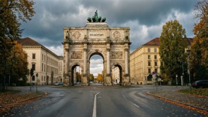 Munich's Siegestor under a dramatic cloudy sky.