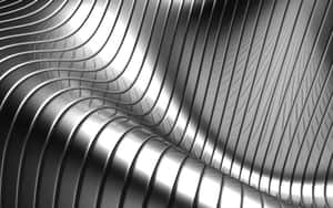 Superfície metálica abstrata com cristas curvas fluidas refletindo luz em tons de prata e preto — Silver Aesthetic Papéis de Parede