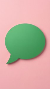 A minimalist design featuring one green chat bubble on a soft pink background. — Whatsapp Wallpaper