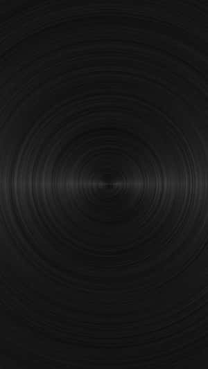 Black abstract wallpaper with concentric circular patterns and subtle gradient highlights. — Solid Black Picture