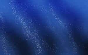 Underwater view with bubbles rising through blue water. — Solid Blue Picture
