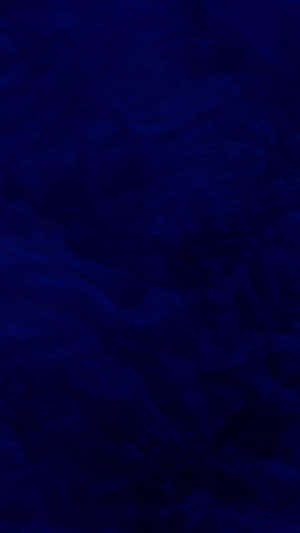 Deep royal blue abstract swirling texture with subtle tonal variations. — Solid Blue iPhone Picture