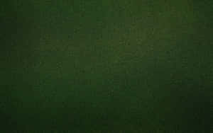 Mörkgrön texturerad tygyta med subtil gradient. — Solid grön bakgrund Bakgrundsbilder