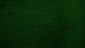 Mur de briques vert foncé avec des lignes de mortier visibles et des variations de texture subtiles