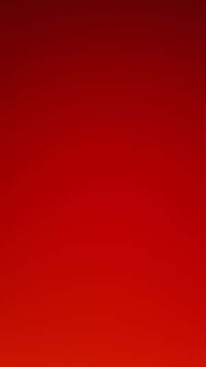 A solid red gradient background with subtle color variation. — Solid Color Wallpaper