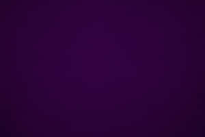 Deep purple textured fabric background for design use.