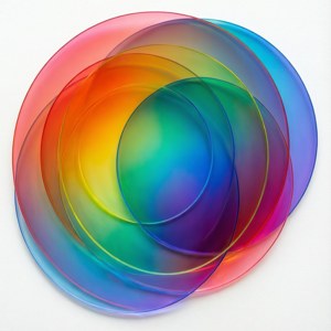 Vibrant overlapping translucent circles in rainbow hues on white background — Spectrum Wallpaper