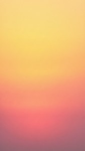 En jevn solnedgangsgradient i gult og rosa for en ren minimalistisk iPhone-estetikk.