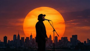 Silhouette of Masta Ace with mic at sunset. — Masta Ace Wallpaper