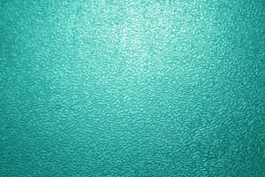 Teal textured glass surface with light gradient and reflections. — Twisted Tea Picture