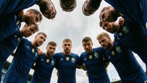 Low angle view of Ciro Immobile huddling with teammates.