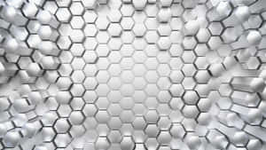 Silver hexagonal tile wall with geometric depth and metallic sheen.