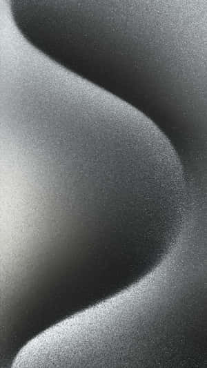 Abstract black and white textured wave pattern with soft gradients.