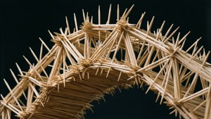 Engineering wallpaper of a toothpick bridge from low angle.