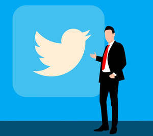 Homme d'affaires en costume faisant un geste vers le logo Twitter sur fond bleu.