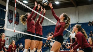 Wallpaper aksi bola voli yang intens menampilkan pemain NMSU saat melakukan smash