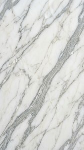 Luxurious white abstract marble with subtle gray veins and polished surface.