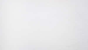 Close-up of a white textured wall surface. — White Full Screen Picture