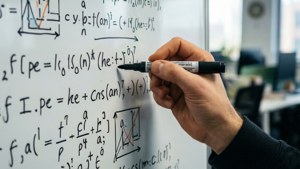 Hand writing math equations on a whiteboard in an office. — Coding Wallpaper